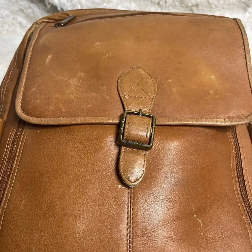 Unbranded tan leather large Backpack antique tone hardwares.